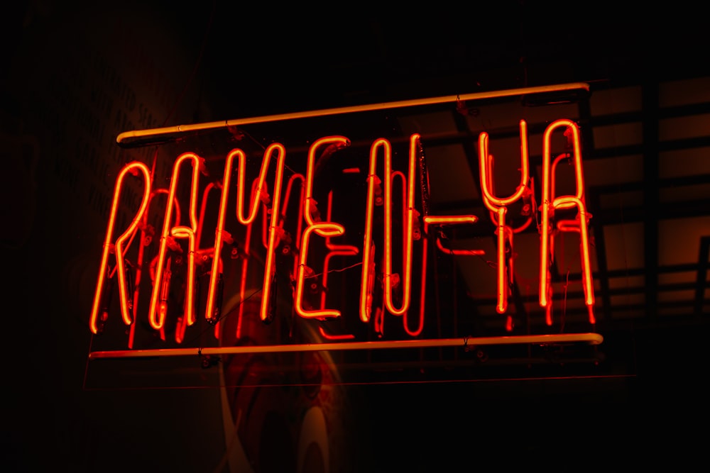 a red neon sign that reads, heyemar