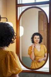 woman in orange dress standing
