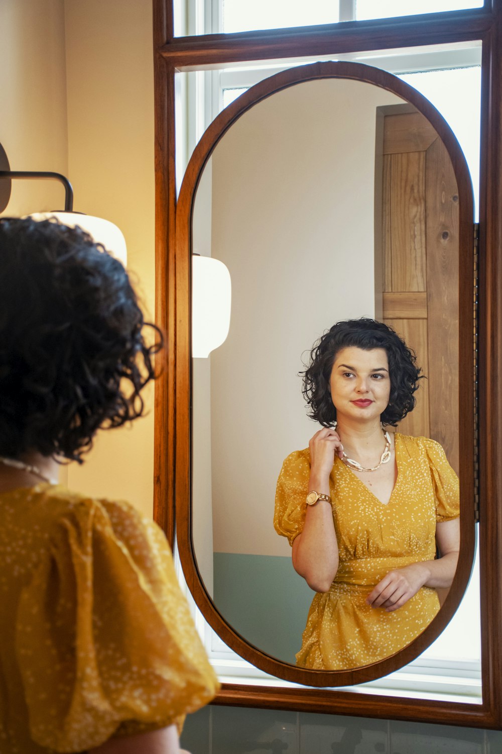 woman in orange dress standing