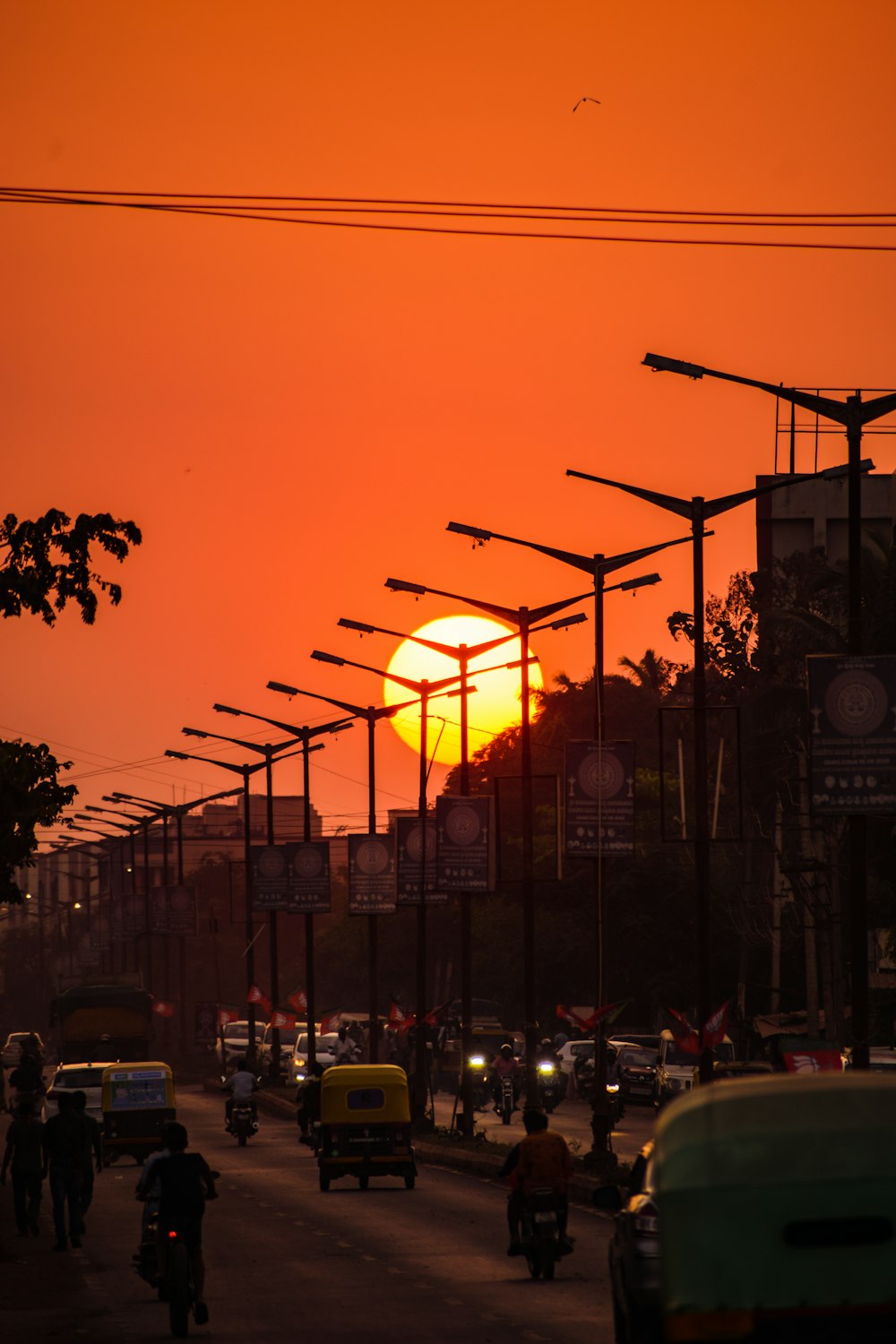 cars parked on side of the road during sunset