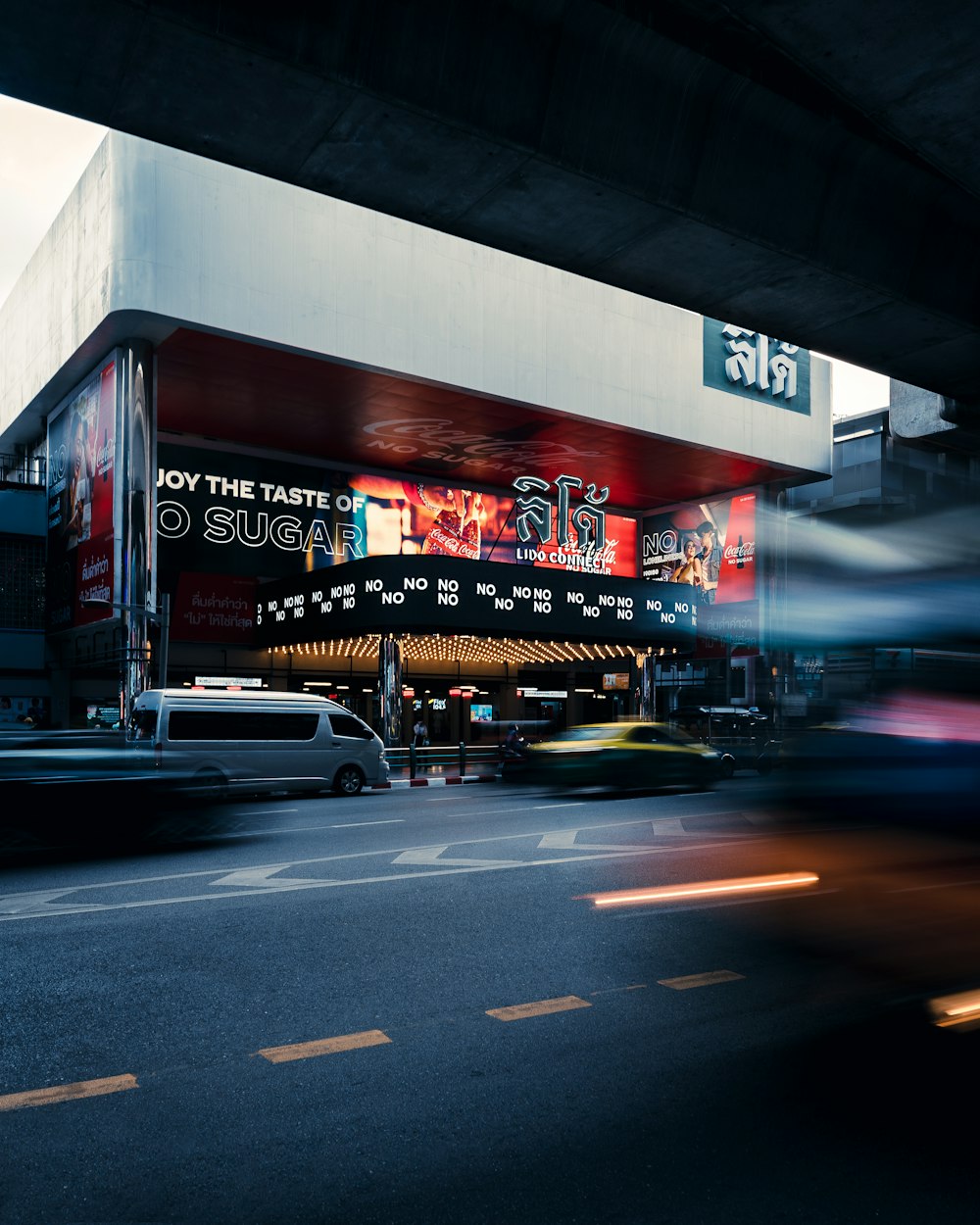 cars parked in front of store during night time