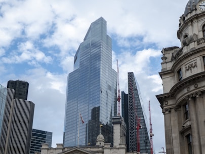 A city skyline featuring both contemporary skyscrapers and classic buildings, symbolizing real estate and growth.