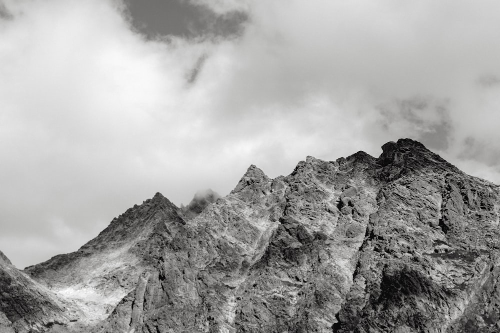 brown rocky mountain under cloudy sky during daytime