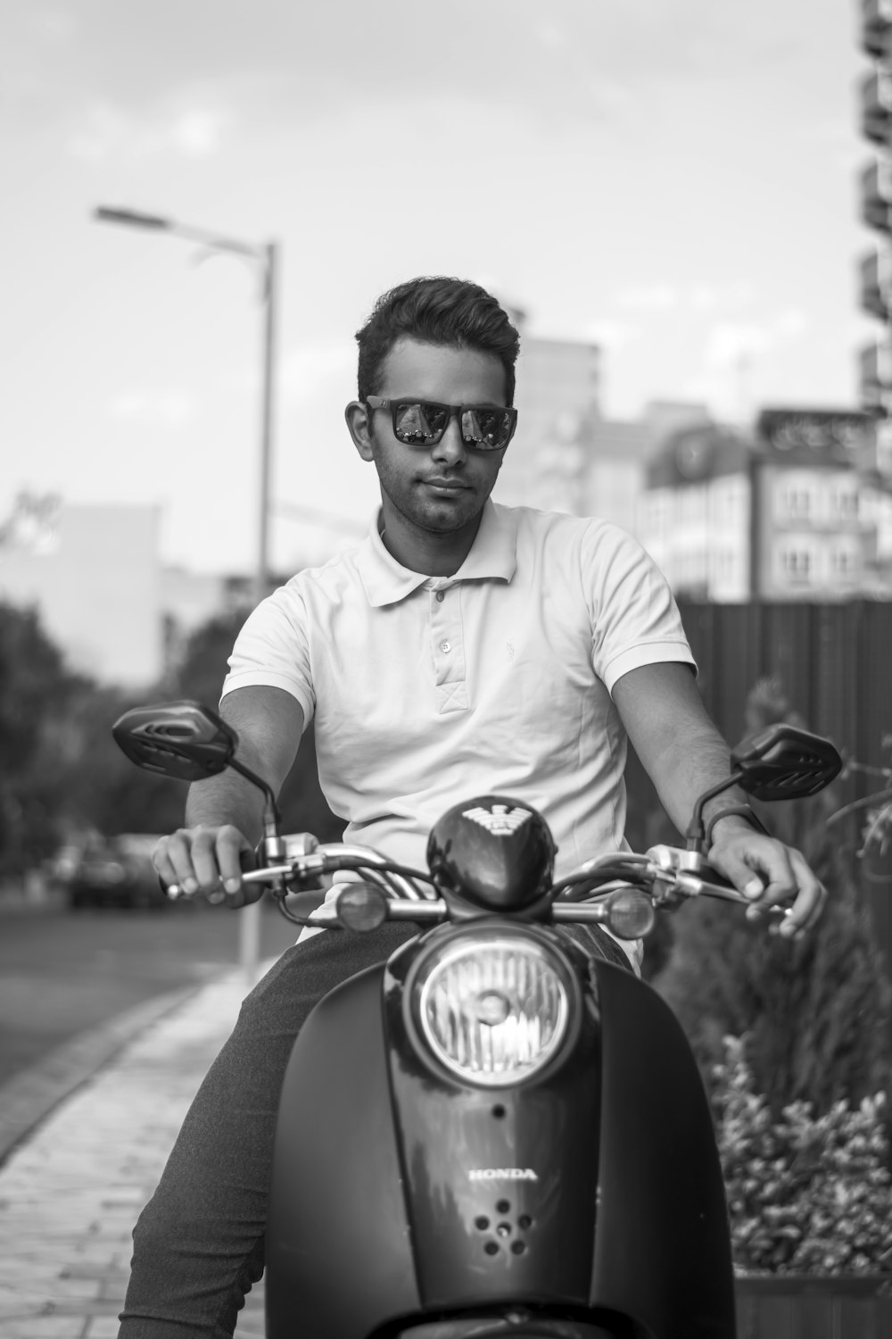 man in white crew neck t-shirt riding red motorcycle