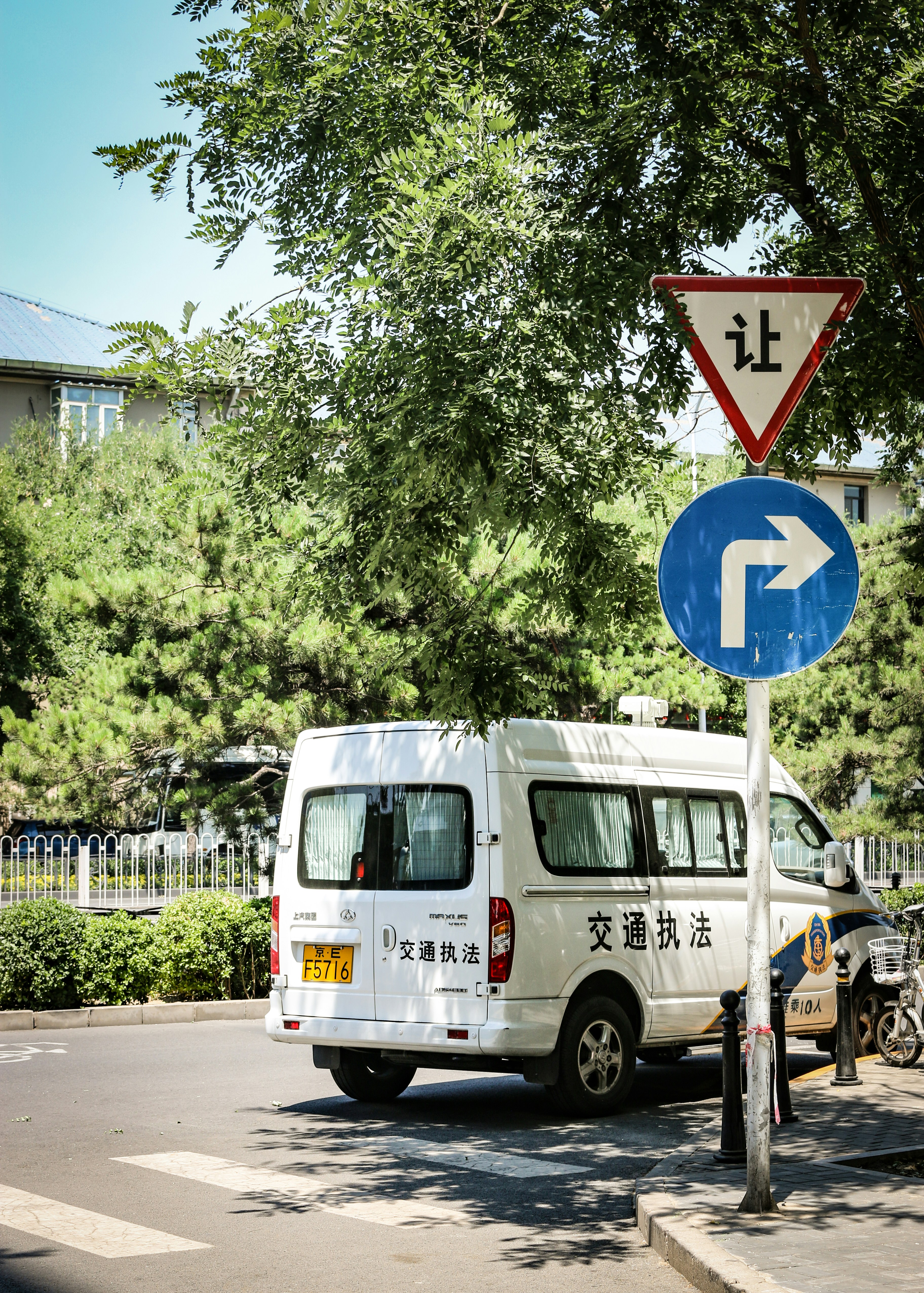white and blue van on road during daytime