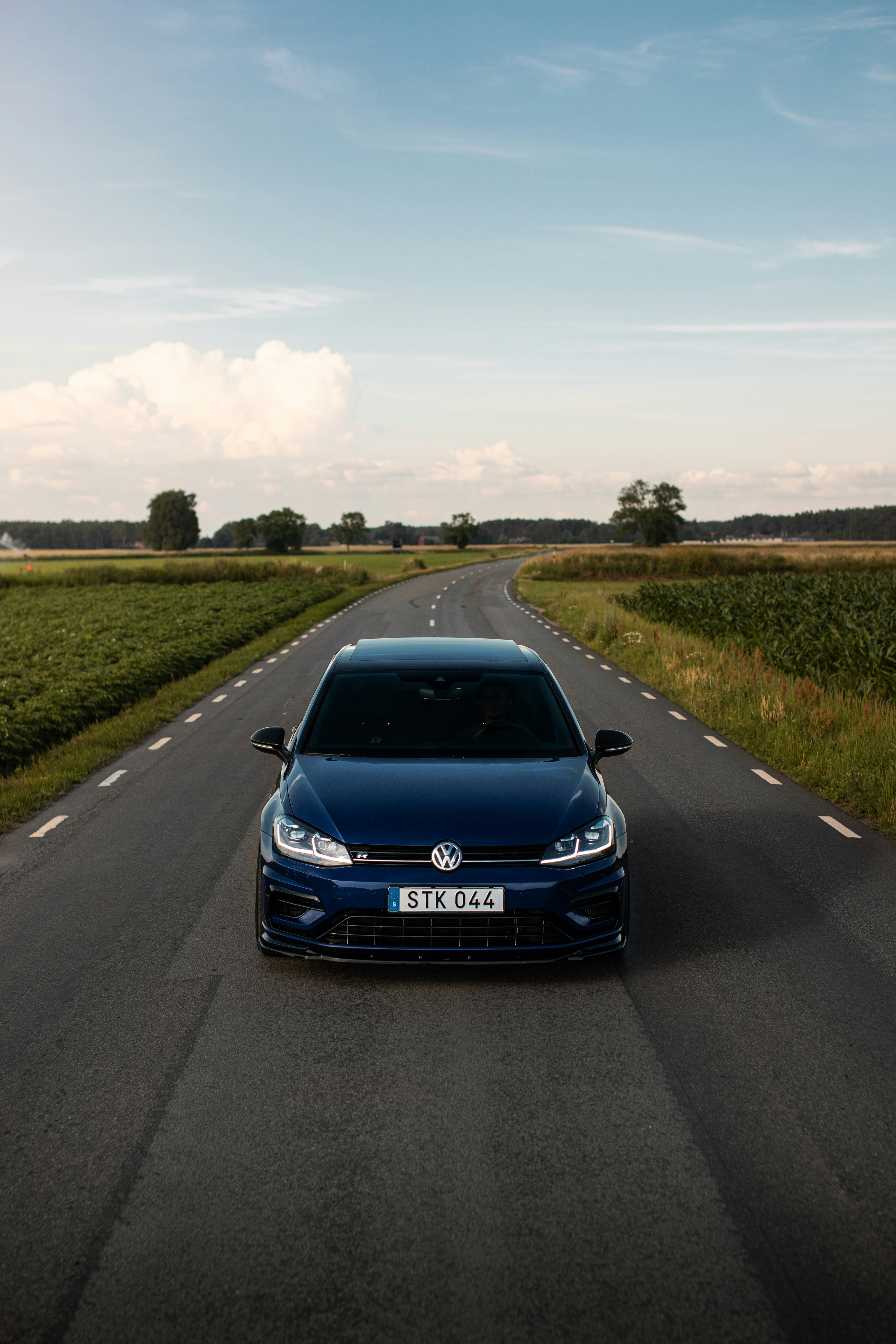 blue bmw car on road during daytime