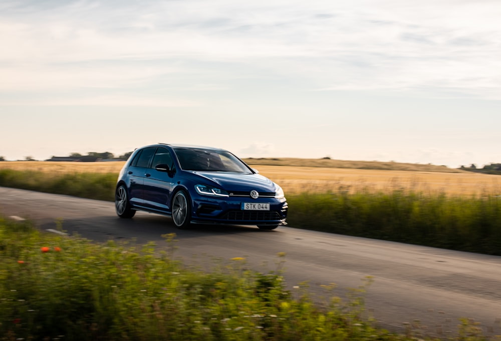 blue honda car on road during daytime