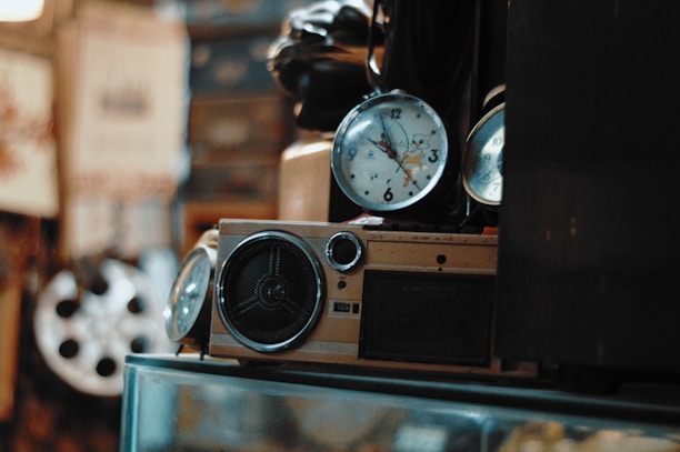 A vintage clock blending into a modern radio microphone symbolizing the mix of classic and contemporary media.