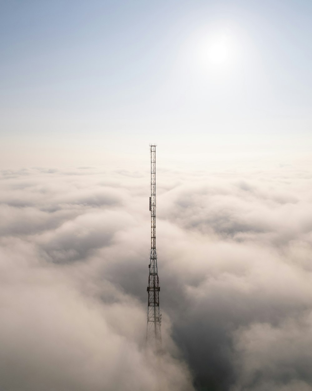 black metal tower under white clouds