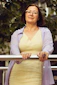 woman in white long sleeve shirt smiling
