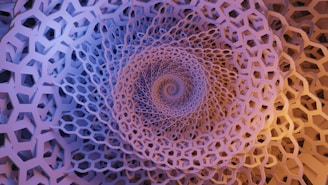 An intricate geometric pattern featuring a spiral composed of hexagonal shapes. The image displays a deep, tunnel-like effect with a mix of repetitive, grid-like structures. The arrangement creates a sense of depth and complexity.
