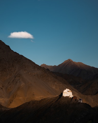 brown mountains under blue sky during daytime
