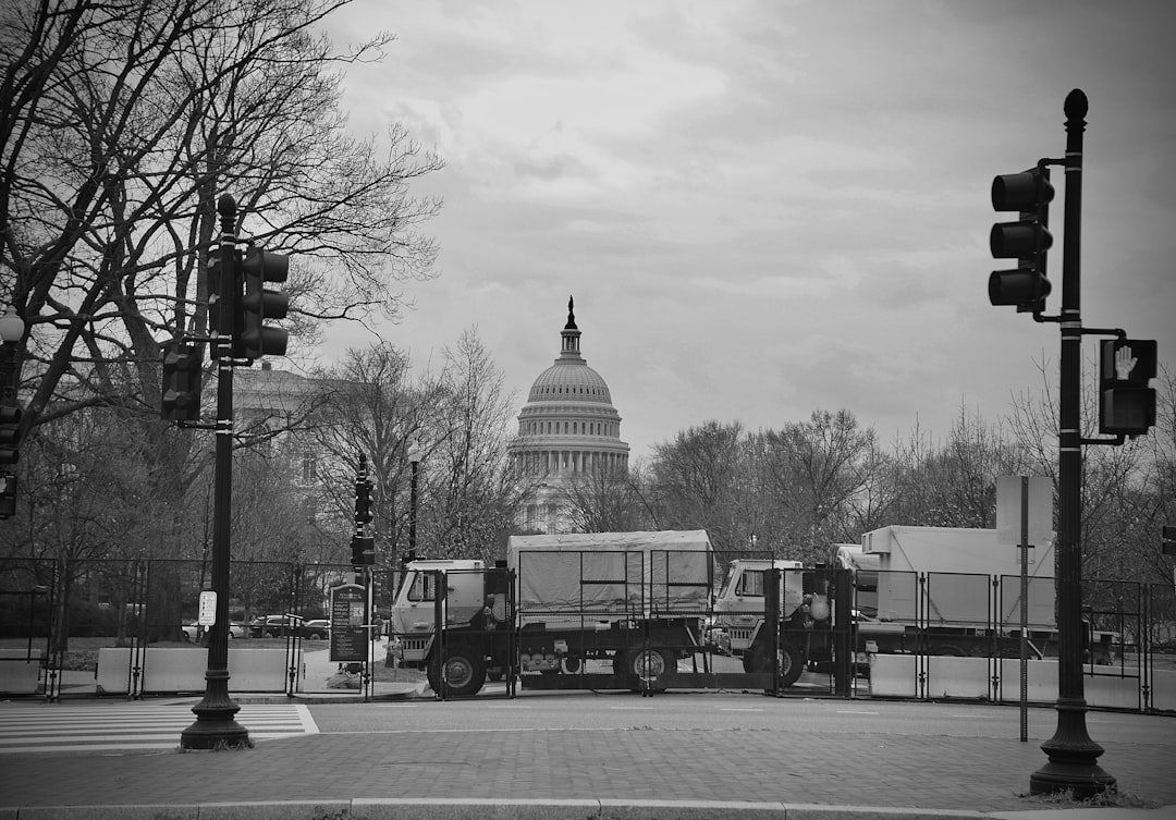 grayscale photo of cars on road