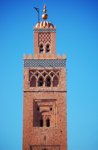 brown concrete building under blue sky during daytime