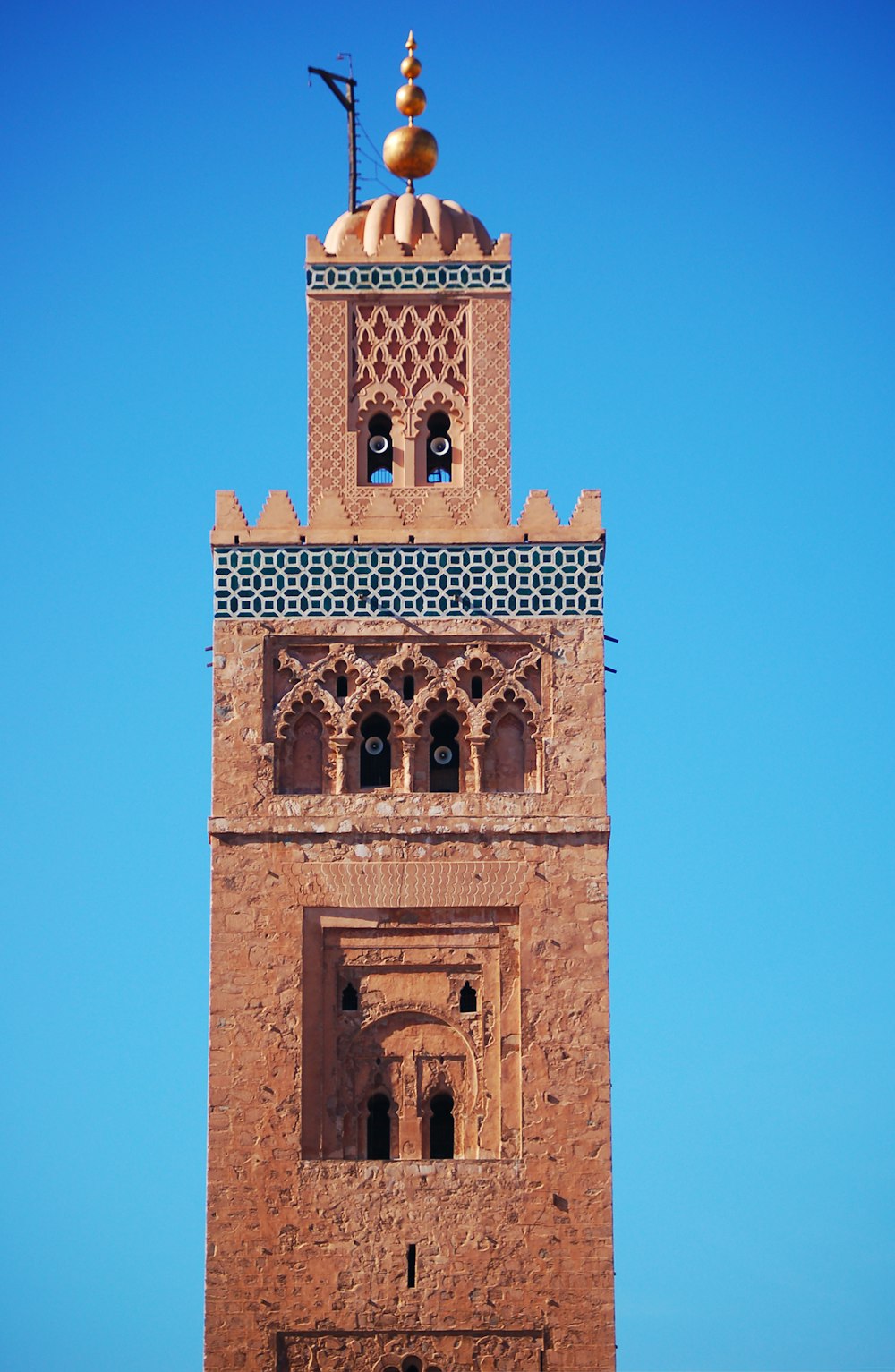 brown concrete building under blue sky during daytime