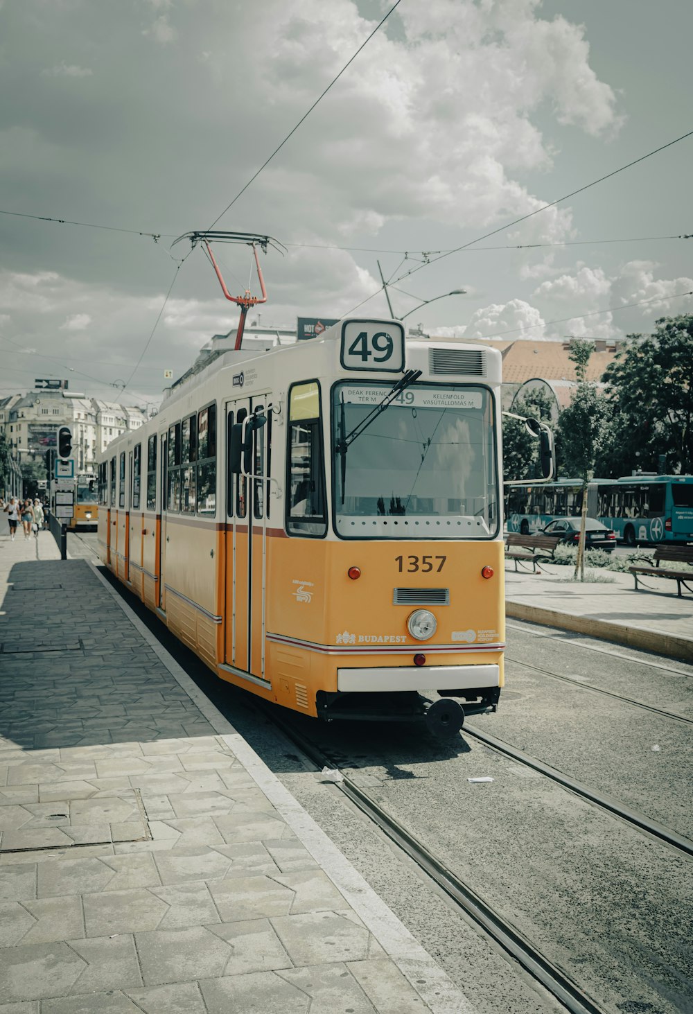 yellow and white tram on road during daytime