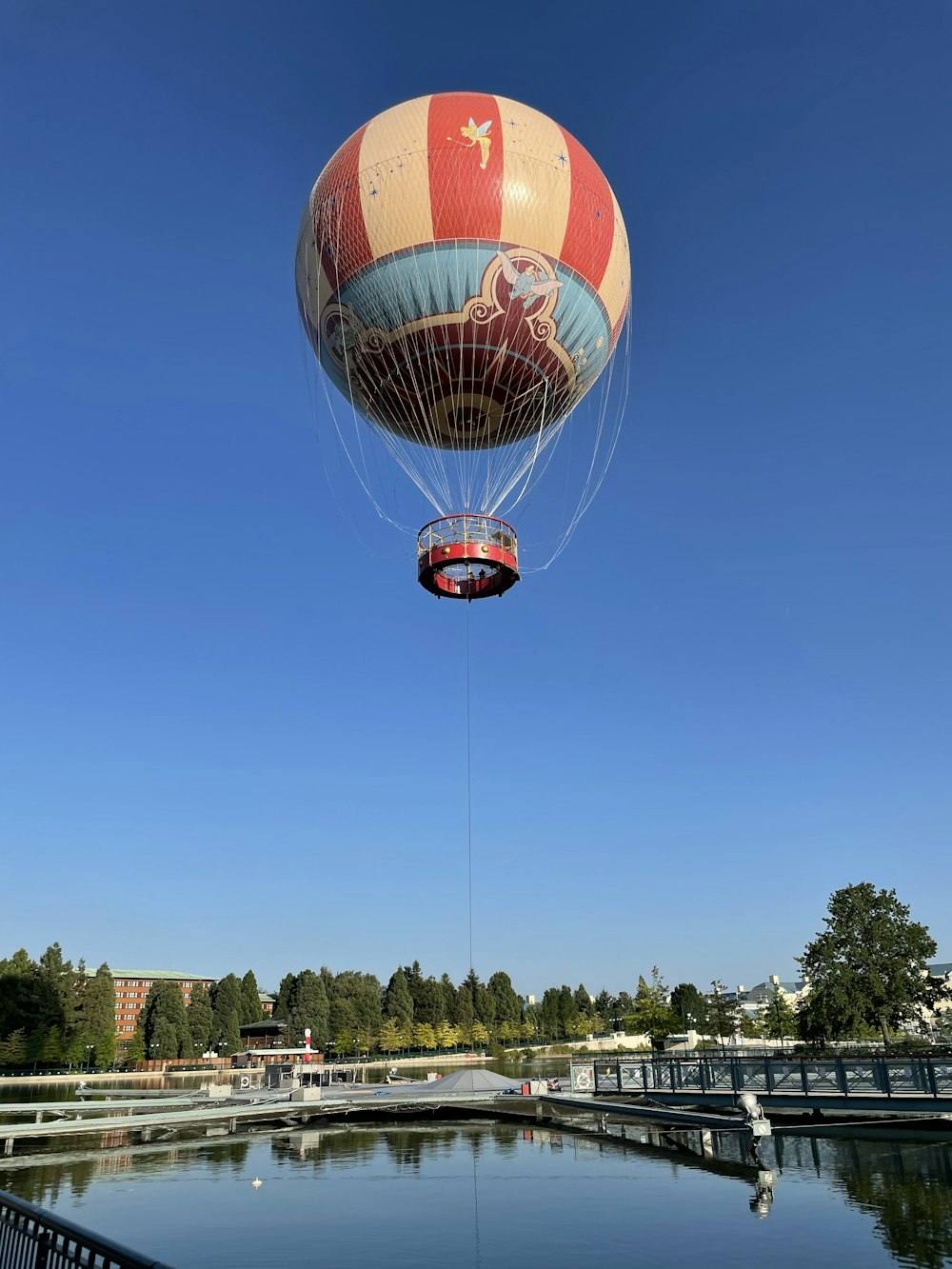 red and white hot air balloon in mid air during daytime