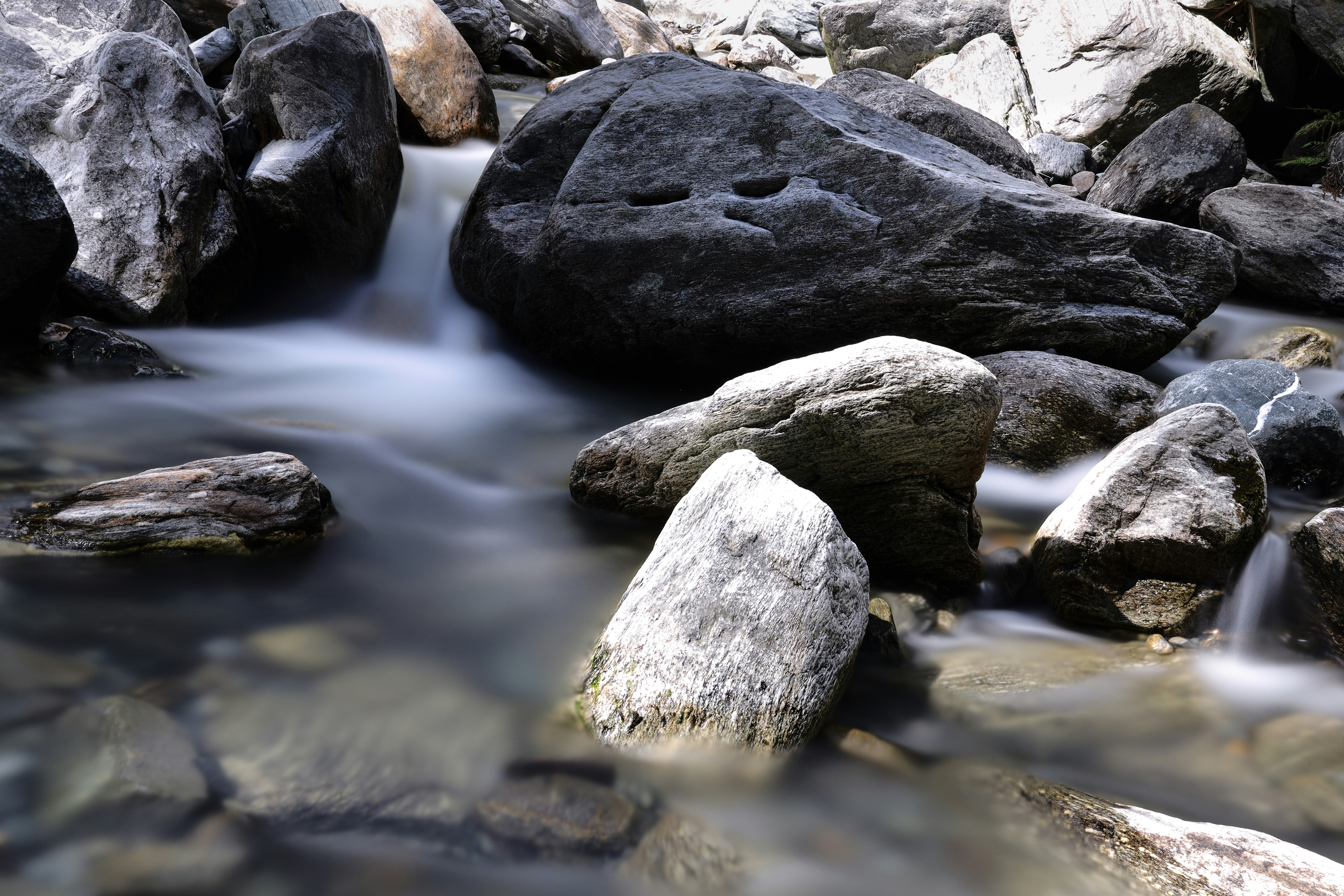 gray and black rocks on river