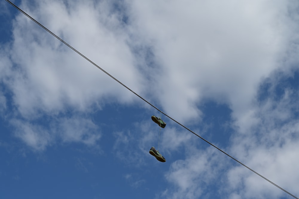 yellow and black cable car under blue sky and white clouds during daytime