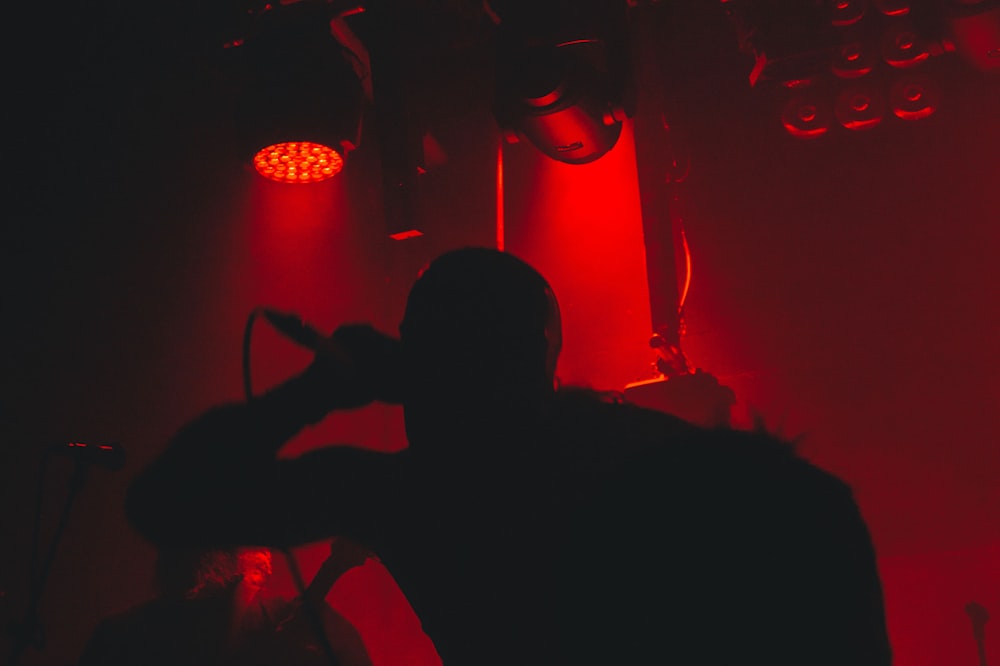 silhouette of person sitting on chair