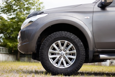 Close-up of the SUV’s rugged tires and alloy wheels.