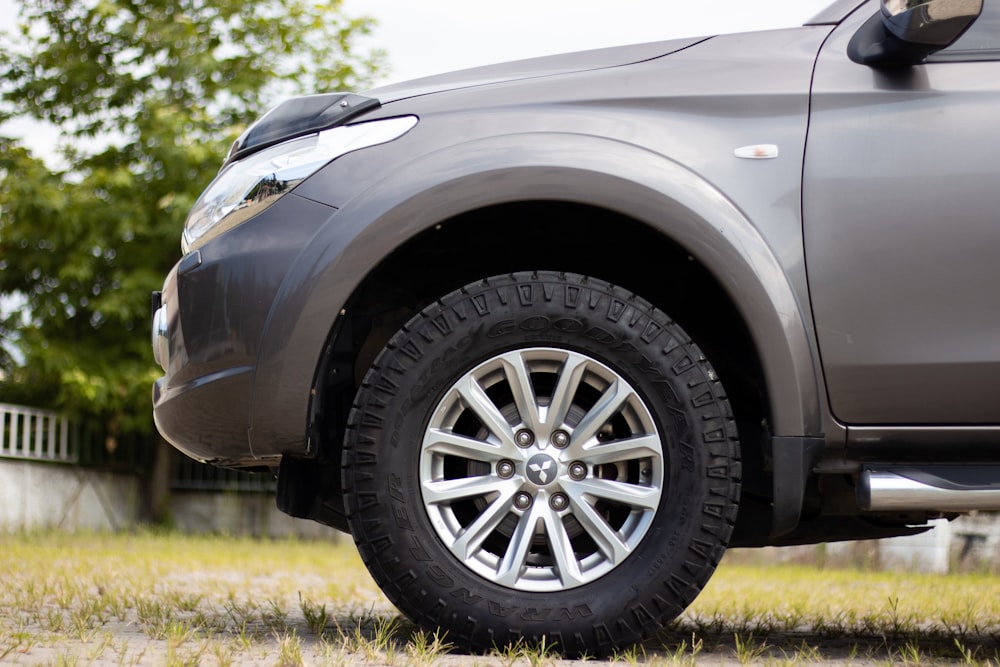 gray car with gray wheel