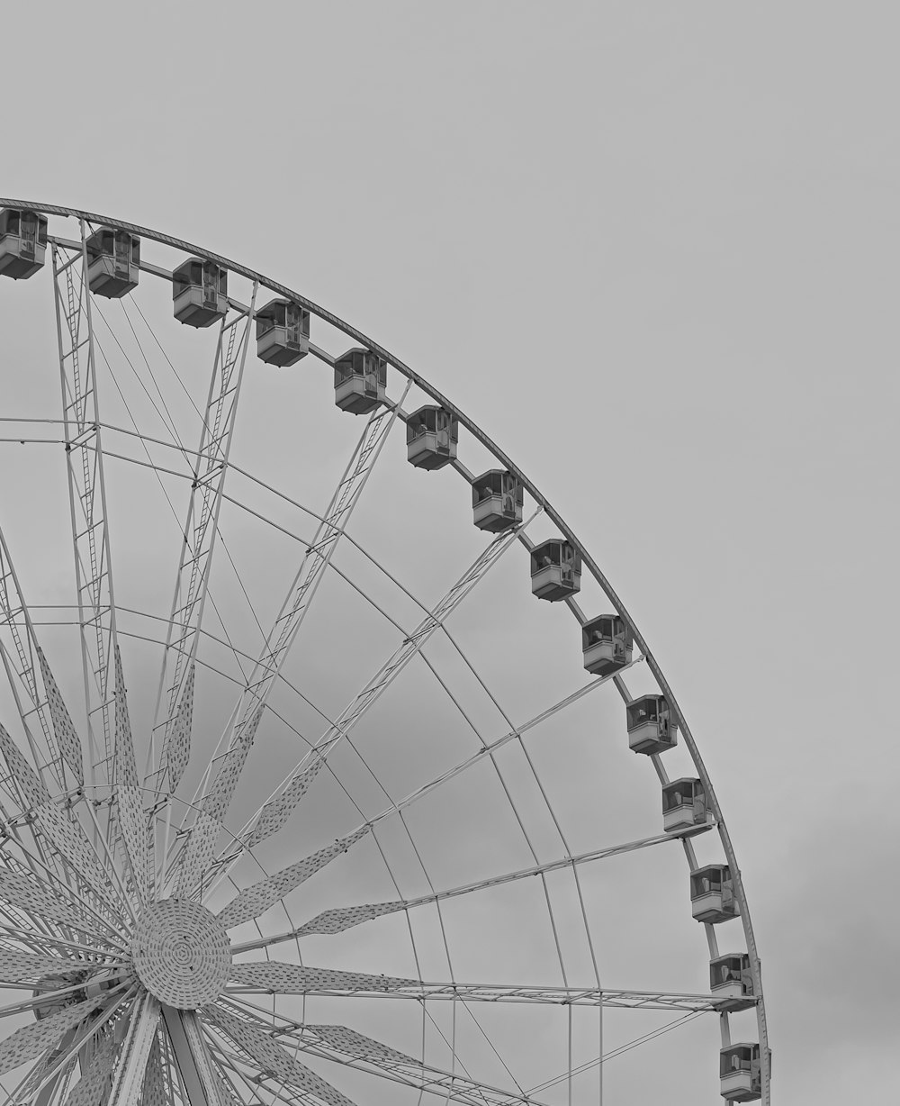 a black and white photo of a ferris wheel