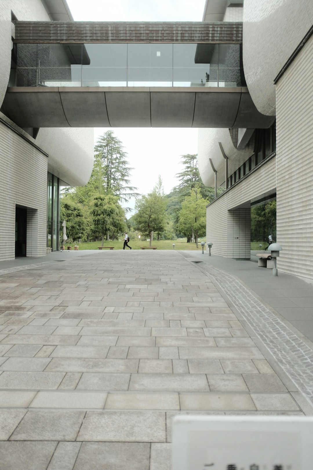 people walking on white and gray tiled floor during daytime