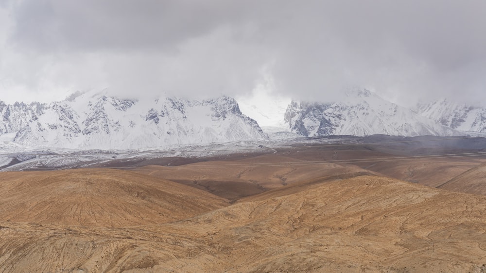 snow covered mountain during daytime