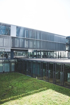 green grass field near building during daytime