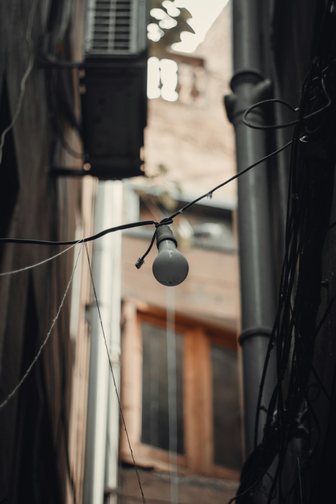 white light bulb on black string