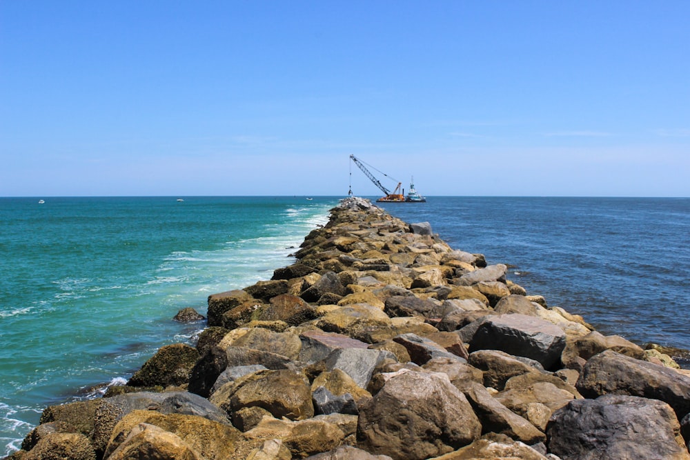 brown wooden dock on sea during daytime