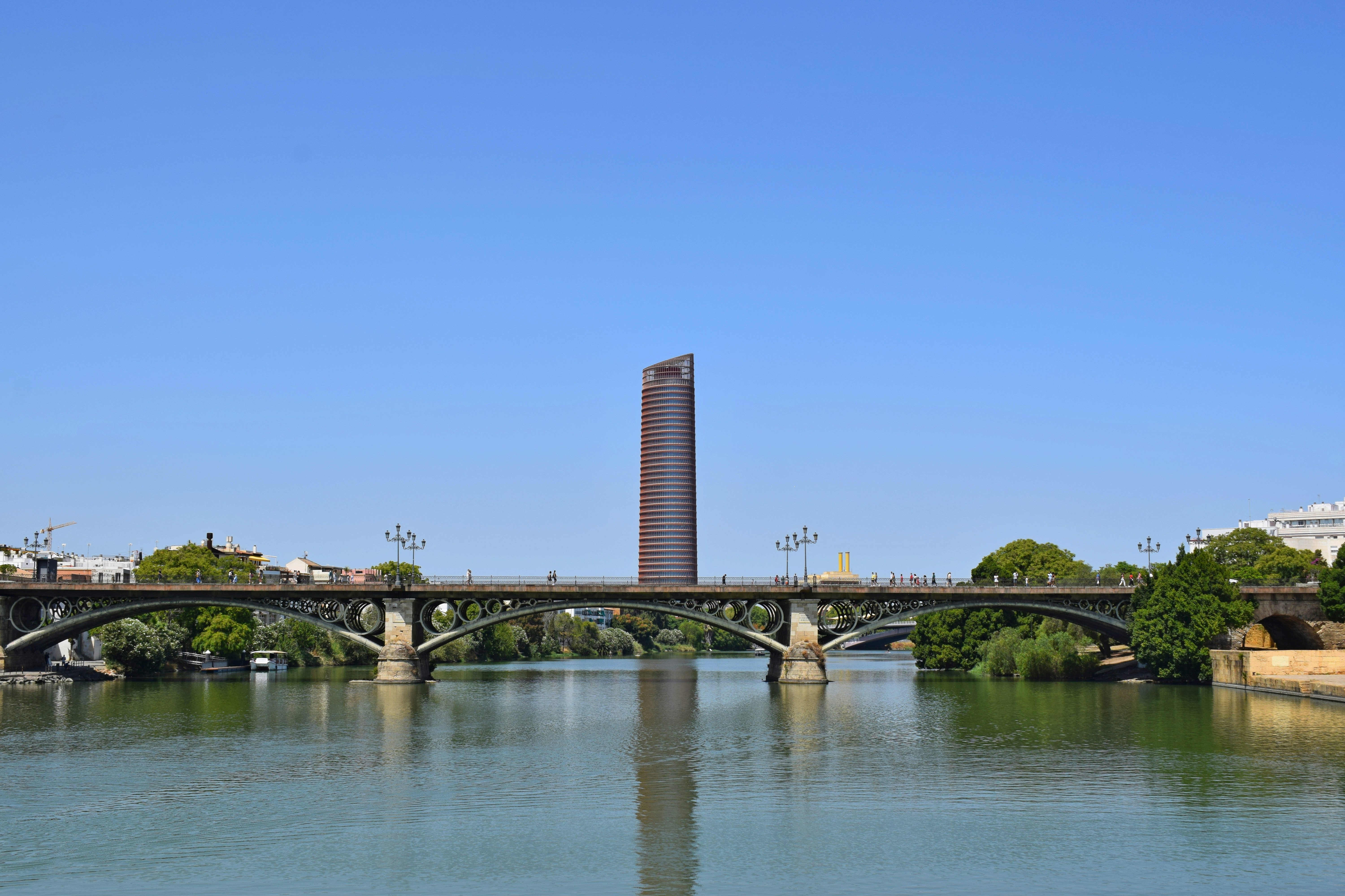 The Triana bridge over the Guadalquivir with the Torre Sevilla beyond