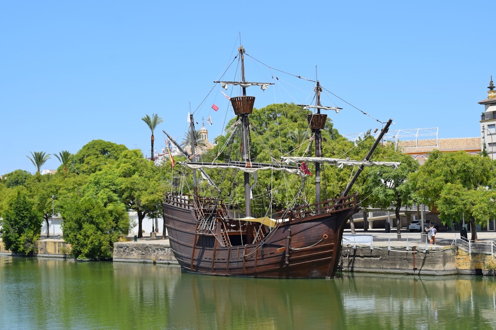 brown ship on river during daytime