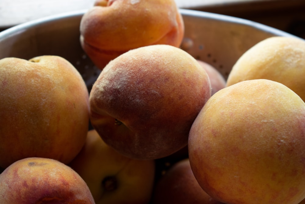 brown round fruits on white ceramic tray