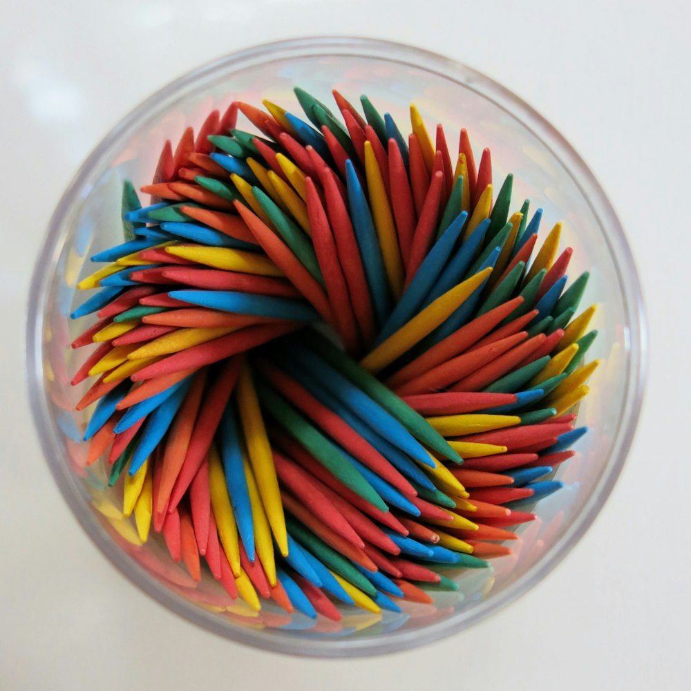 red and brown sticks in clear glass bowl