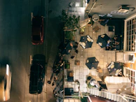 Our solar-powered patio in action during a sunny afternoon, with customers enjoying their drinks under eco-friendly shades.