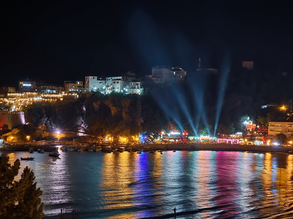 city skyline with lights turned on during night time