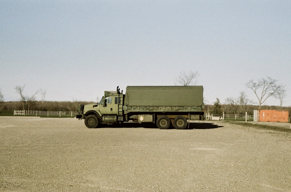 green truck on road during daytime