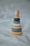 white and brown wooden chess piece