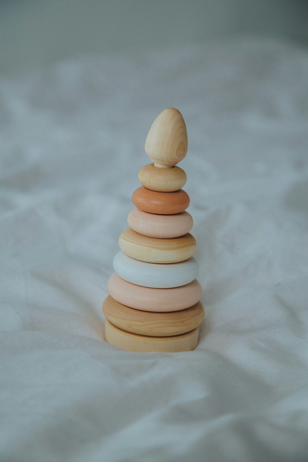 white and brown wooden chess piece