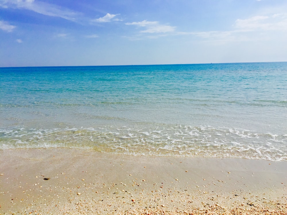 blue sea under blue sky during daytime