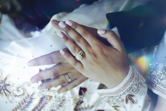 person wearing silver diamond ring