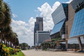 people walking on sidewalk near high rise building during daytime