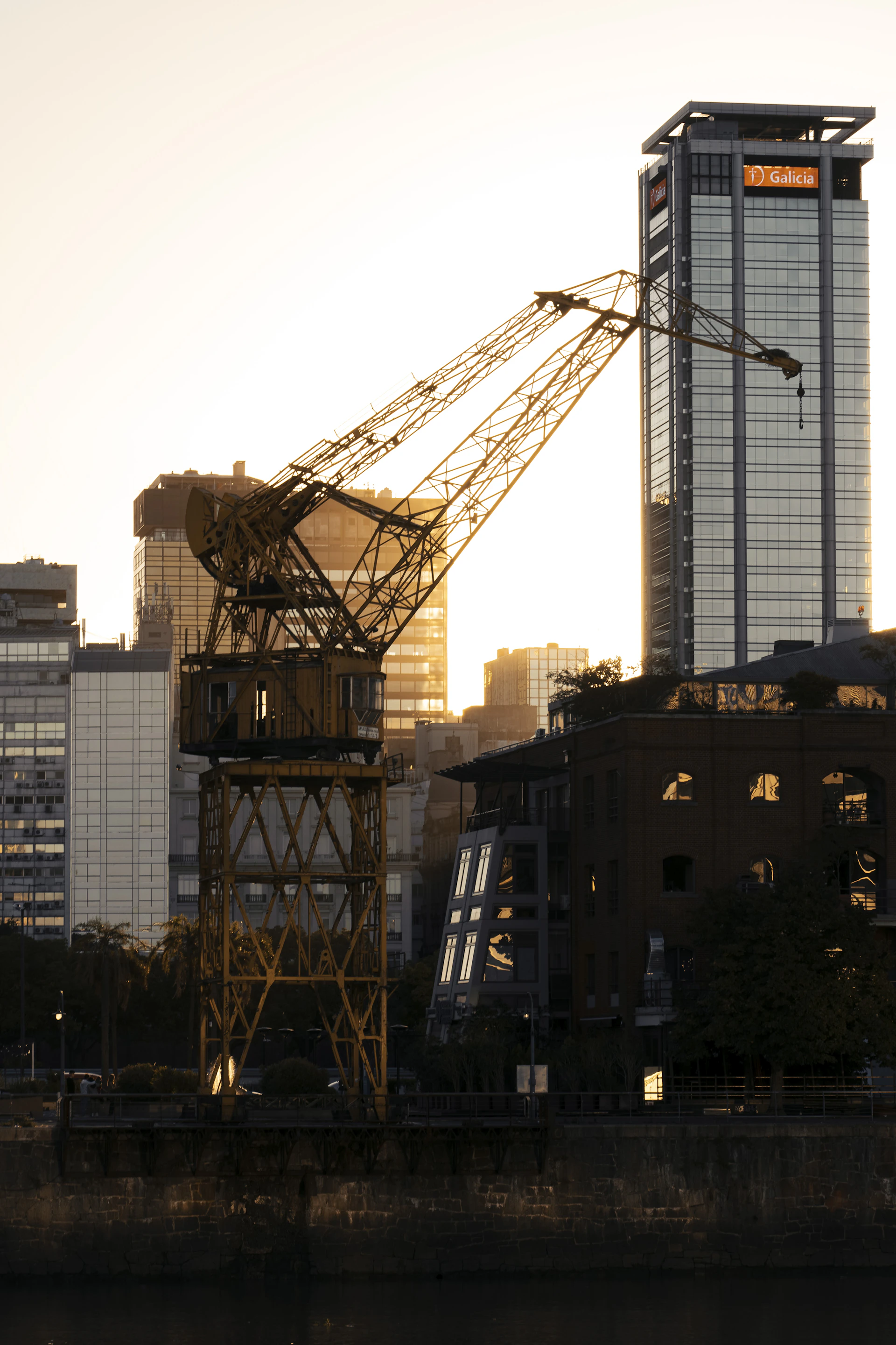 An elegant skyline at dusk featuring cranes and mining machinery, symbolizing JJSR Corporation's impact across India's infrastructure and mining sectors.