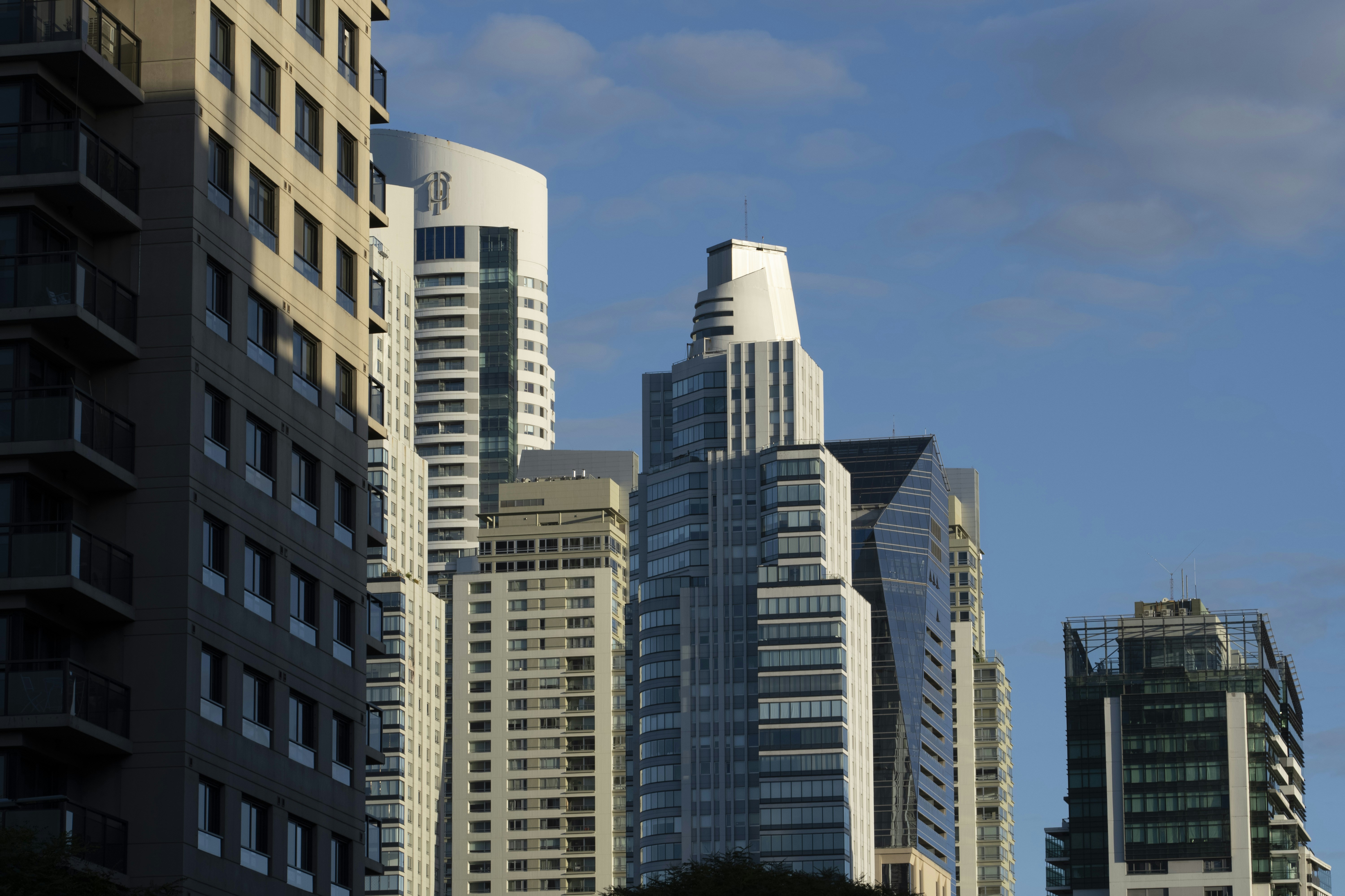 white and brown concrete building under blue sky during daytime