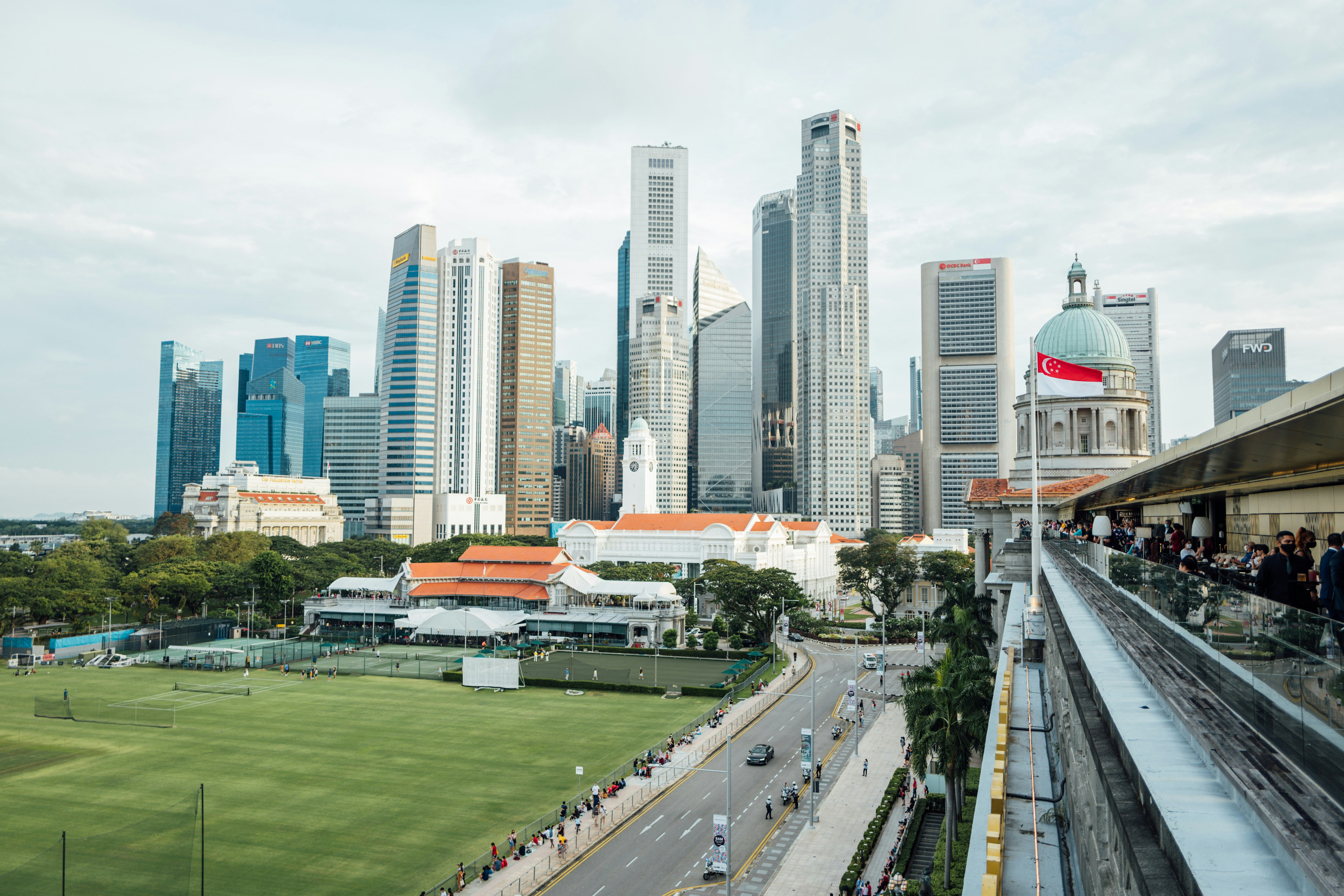 cars on road near city buildings during daytime