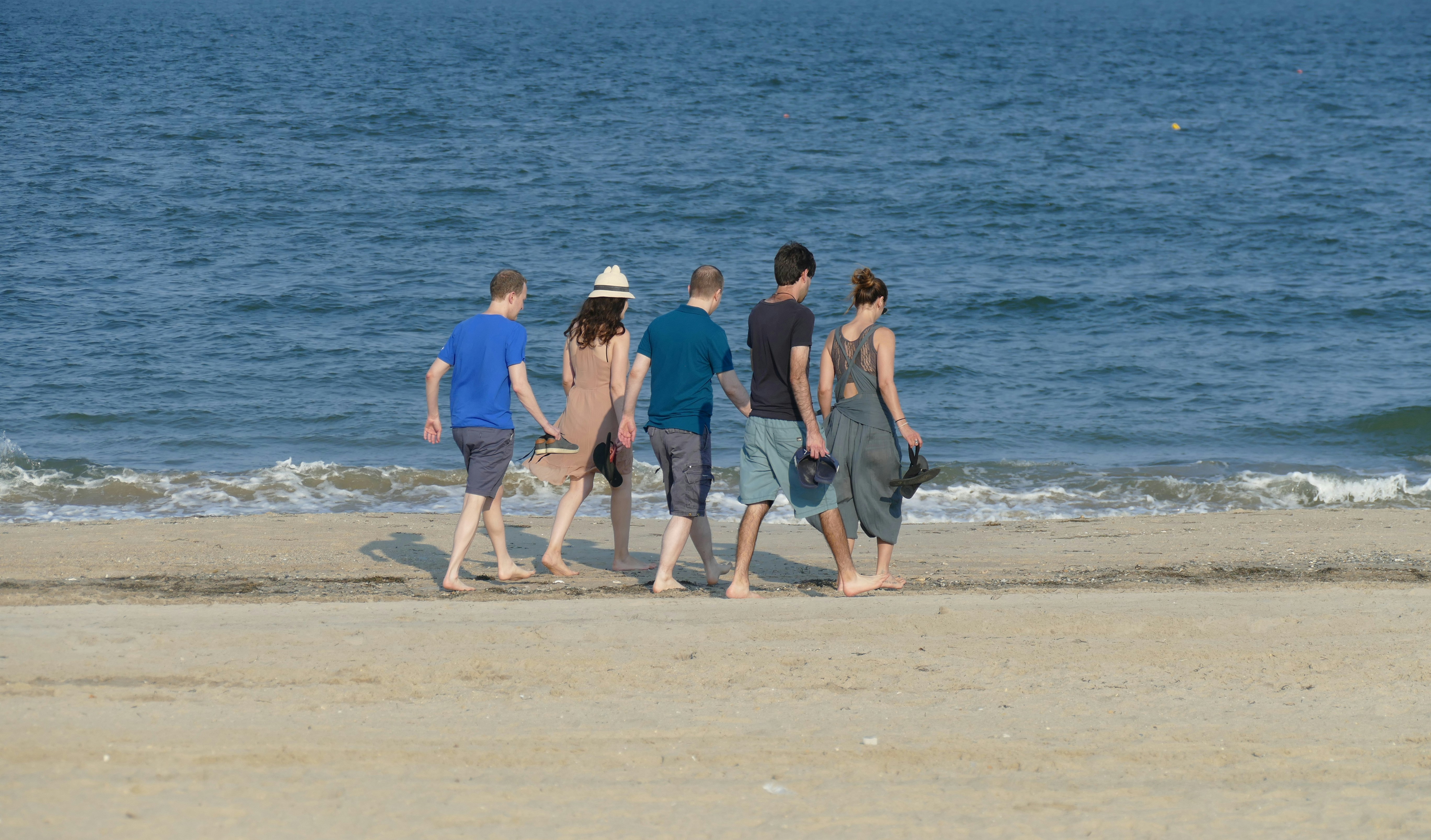 Guests walking on beach