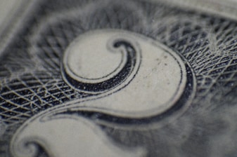 Close-up of a sleek paper currency counting machine in action