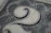 Close-up of a crisp US dollar bill highlighting the intricate engraving around the portrait.